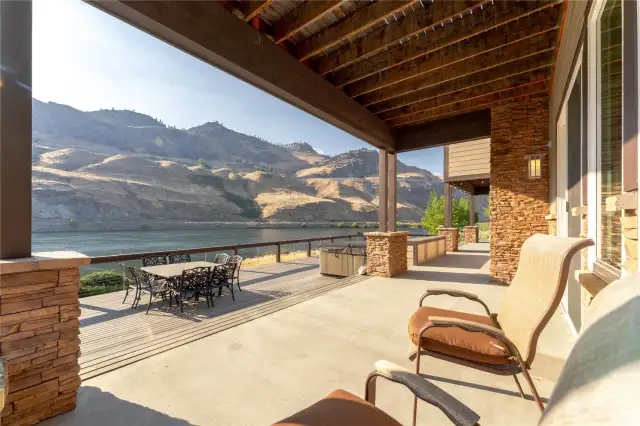 View of waterfront deck and outdoor dining area overlooking the Columbia River.