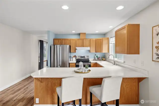 Kitchen window provides side yard and patio views.