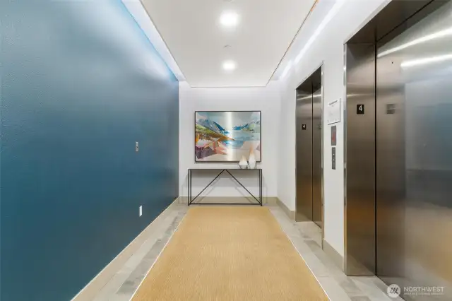 Elevator Building with classic hallways and modern art.   Take the elevator up to R  to enjoy the rooftop deck.