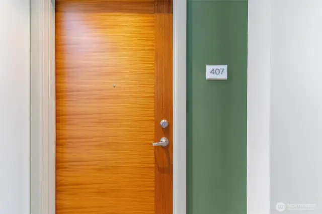 Warm Sapele wood entry door to unit