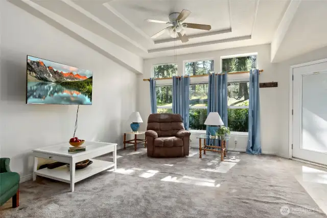 The family room has a door that faces the front of the property.