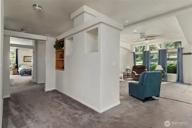 The spacious hall leads to the bedrooms and laundry room.