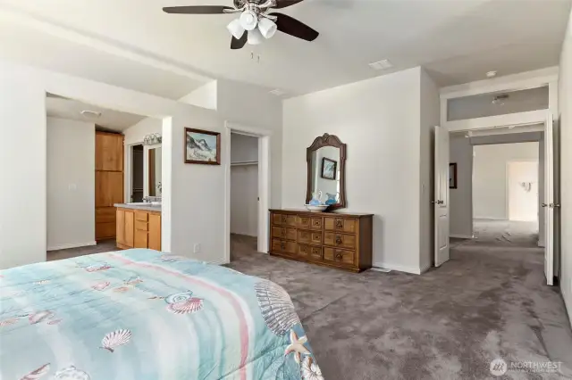 French doors open into the huge primary bedroom with walk in closet and five piece bathroom.
