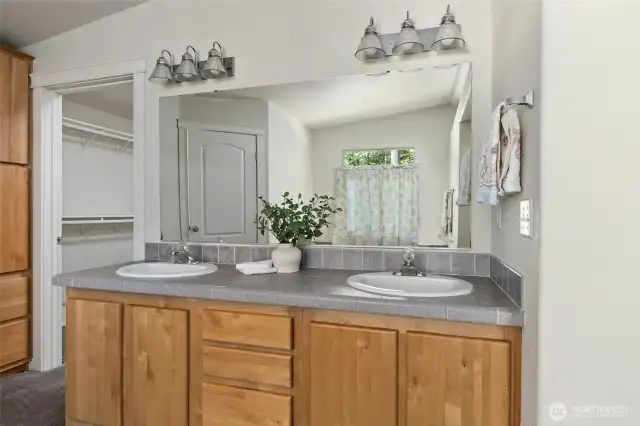 Primary bathroom with walk through into walk in closet.