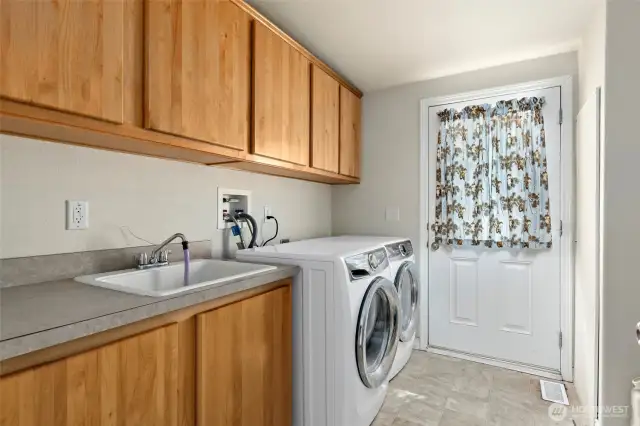 This laundry room/mud room has an exterior door.