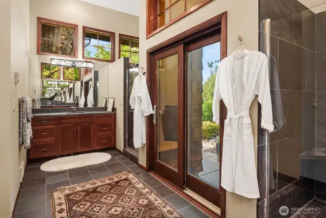 Primary suite bath with his and hers showers.
