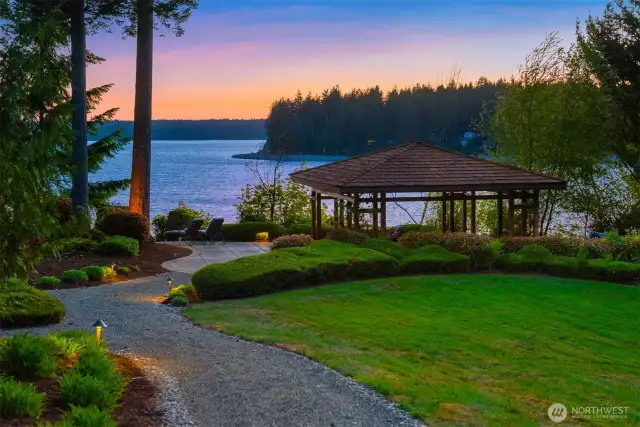 Serene setting.  Property is well lit with curated lighting illuminating the paths and trees. This gazebo is host to a wide array of activities.