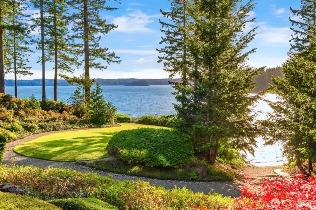 120' Douglas Fir trees frame Puget Sound.  Listen to the cool breezes whistle though the branches.  Views of Case Inlet and the tips Olympic Mountains. This trail goes down to the shore.
