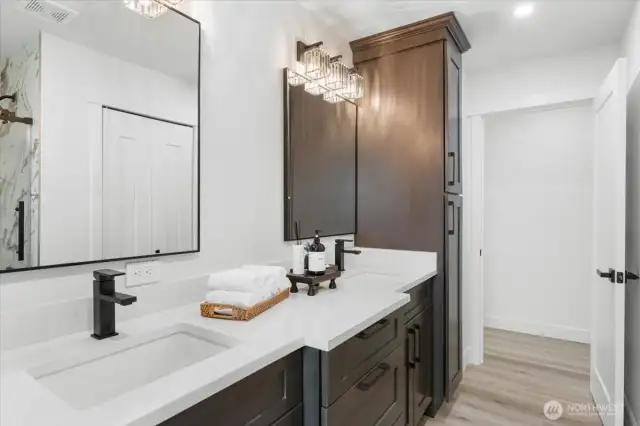 Main bathroom with quartz counter tops and double sinks and tons of storage.  Large closet for storage as well.