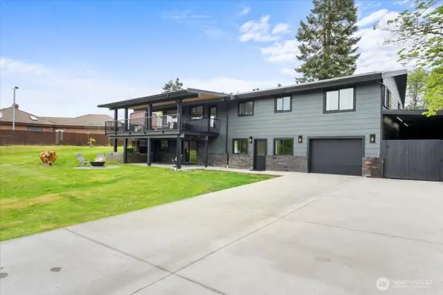 Enjoy your back yard with firepit.  Concrete driveway is large enough for pickleball!
