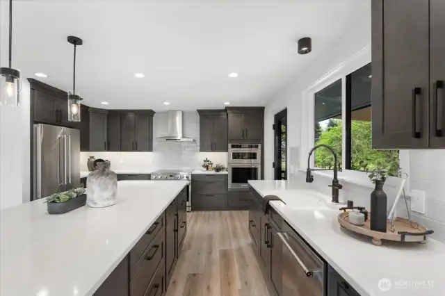 Kitchen Aid Fridge, Dishwasher, Oven Microwave Combo. 36" Thor Freestanding Range. Beautiful backsplash that highlights the cabinets.