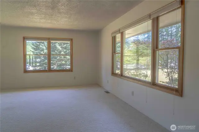 Upper living room with view of surrounding property.