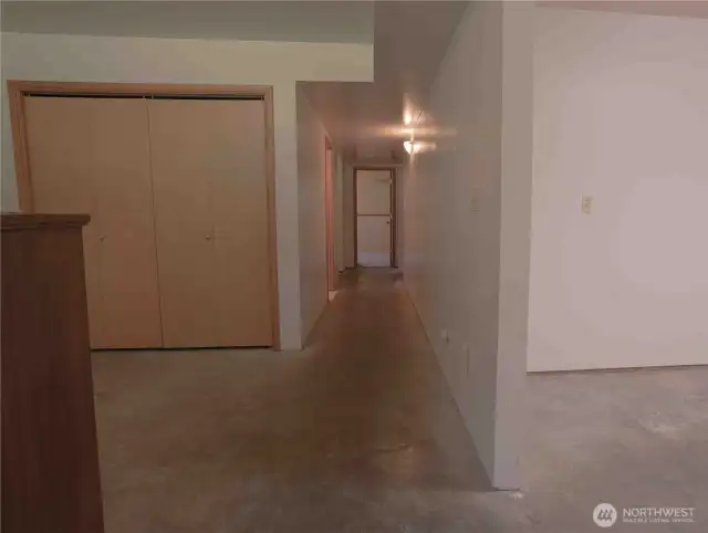 Main room on lower level. Rear access door to backyard. 2 bedrooms and kitchen. Perfect for rental or 2 generations to live together.