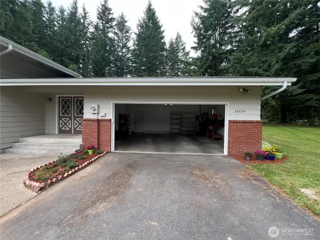 Oversized insulated 2 car garage. Room for cars and additional storage or freezers.