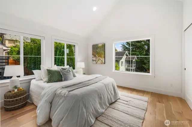 Vaulted ceilings bring extra volume to the South/Southeast primary bedroom.
