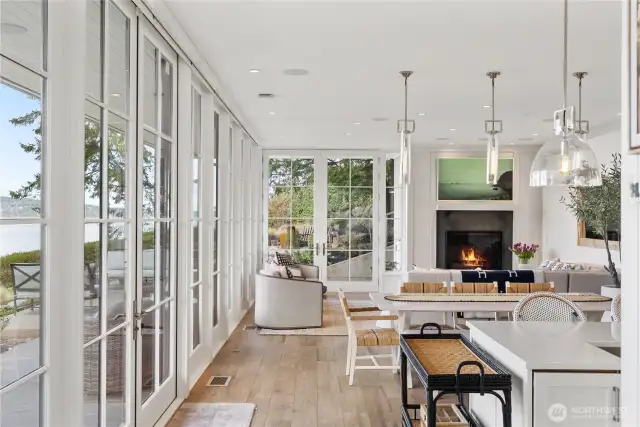 Walls of Pella Architectural Series glass frame the views, while Lutron Sequoia automated shades modulate light with effortless elegance.