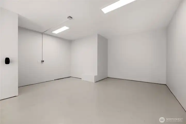 Garage just renovated… Can be living space. Epoxy floors and fully finished walls and ceilings.  Wired for E-Vehicle Charging.