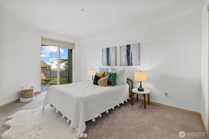 Guest bedroom with access onto outdoor deck area