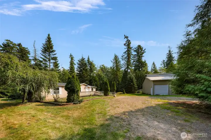 Three bedrooms/2 baths/1755 square feet on 4.36 acres and a huge shop too