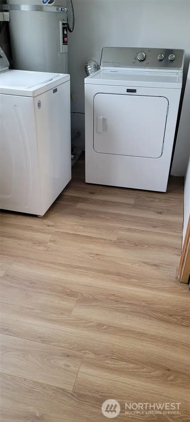 New floor in utility room. Washer and dryer stay!