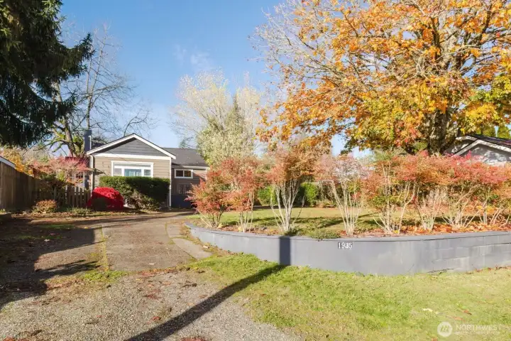 Terraced front yard with mature hedge, plus the setback of the home provide added privacy.