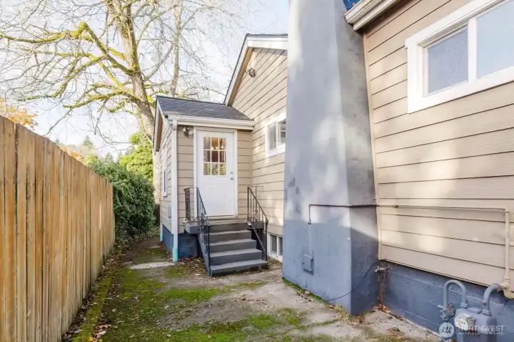 Side-door entry to kitchen from backyard.