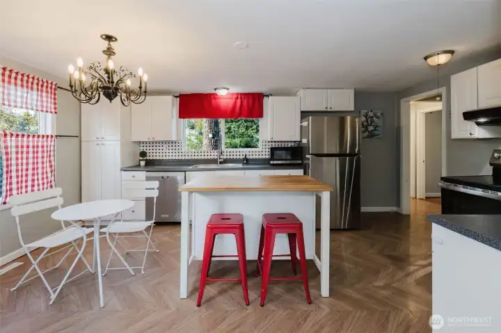 Unique, open kitchen with eating space.