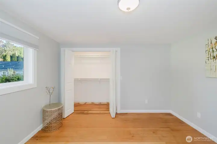Primary bedroom features large, well-lit closet.