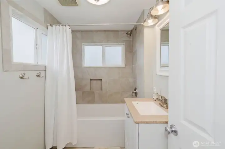 Main level bathroom has been fully updated, with lots of natural light.