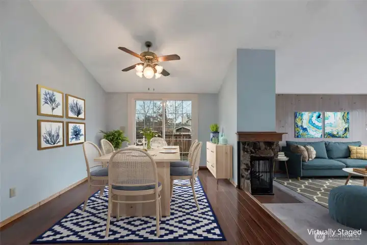 Virtually staged dining room with living room to the right.
