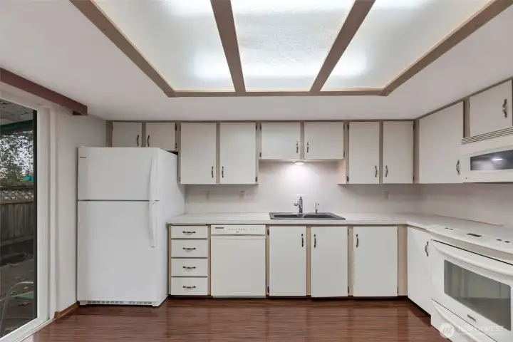 Another view of kitchen. All appliances included. Slider to the left leads to garage access.