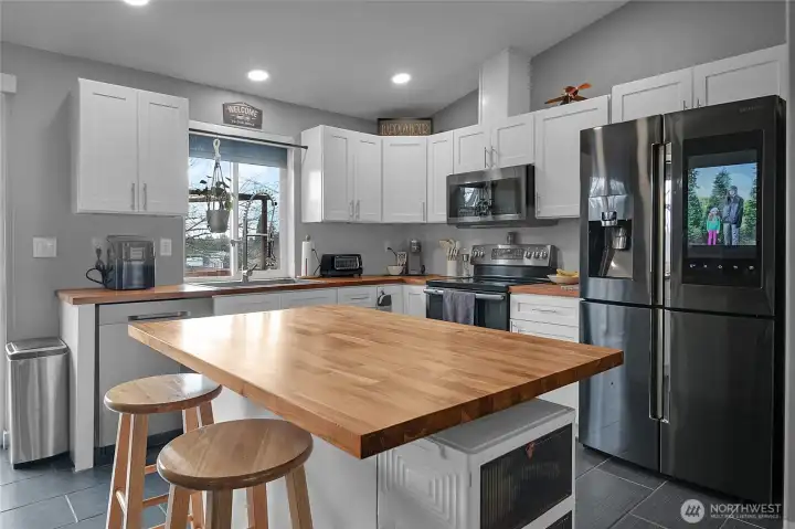 An open, inviting kitchen with island makes living and entertaining a breeze.