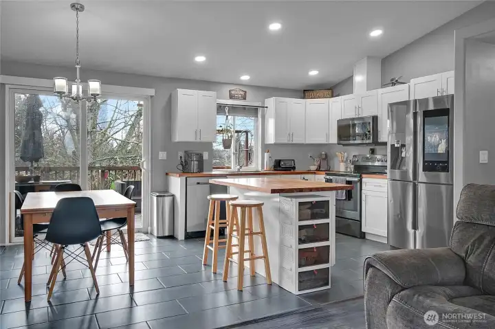 The dining area adjoins the kitchen.