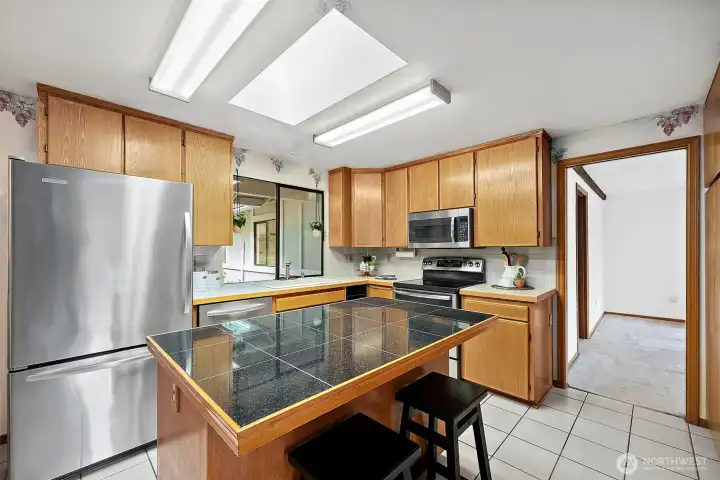 From the family room, enter the kitchen.