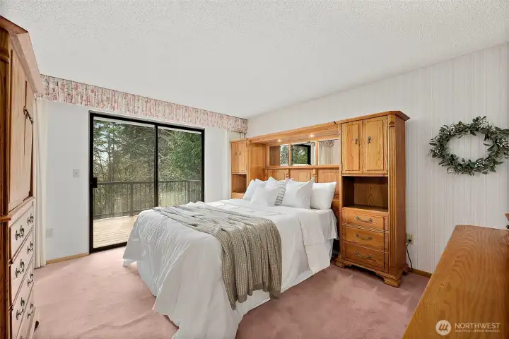 The primary bedroom will comfortably accommodate a queen size bed with a grand headboard and a couple of pieces of bedroom furniture.