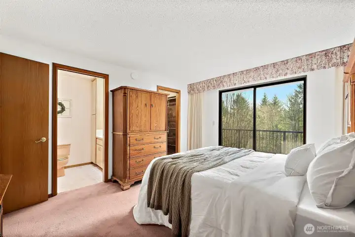 The primary offers access to the deck.