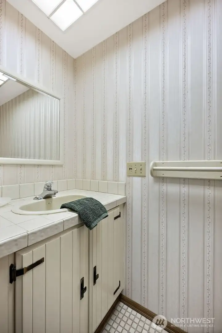 The powder room entered from the laundry room.