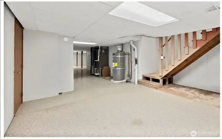 The stairway from the hallway from the laundry room lands here.  It's a versatile space.  Keep it utility?  Create a living area?  Your choice.