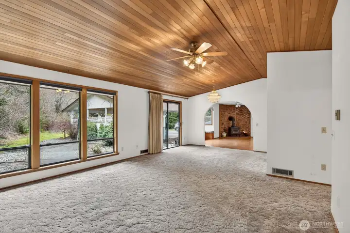 Large windows look out to the patio and the private setting.