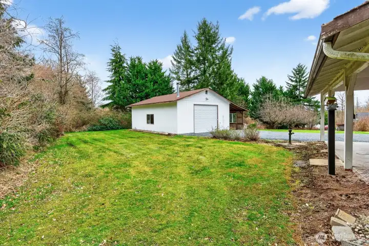 Yard space off the shop, great sunny location for gardening.