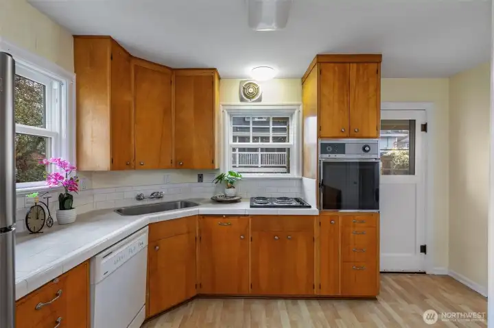 Classic kitchen with door to the back yard.