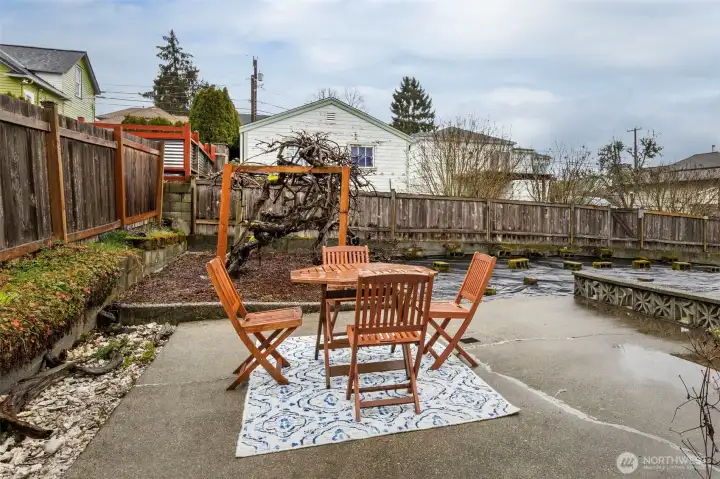 Bring your friends and entertain in this lovely patio next to the grape arbor.