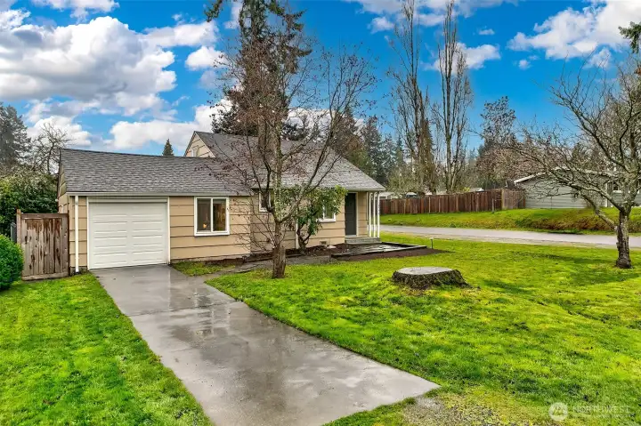 Clean mid-century lines and thoughtful exterior updates reflect the stewardship and care invested in this home, set on a generous corner lot in a desirable Shoreline neighborhood near parks, trails, and everyday conveniences.