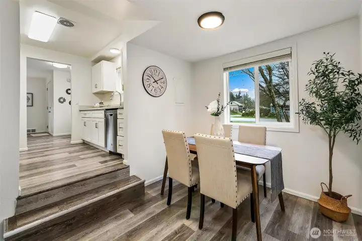 A sunny dining nook offers a comfortable spot for everyday meals with views toward the front yard.
