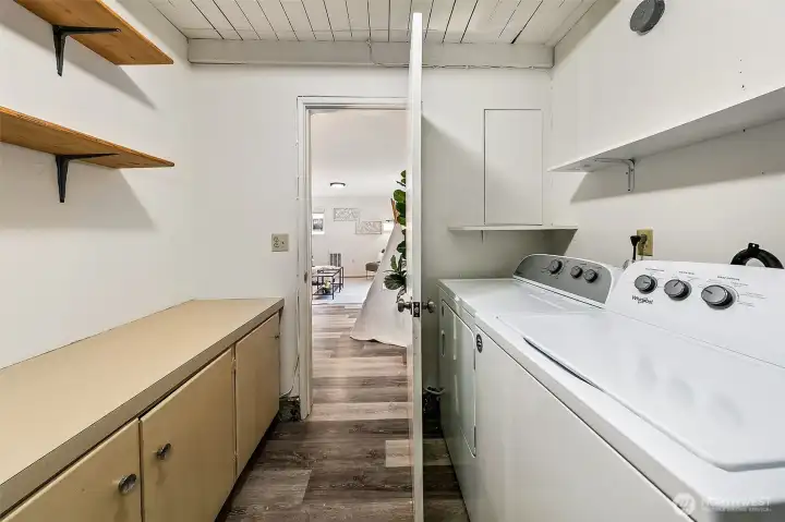 A dedicated laundry and utility space keeps the rhythms of daily life organized, with room for folding, storage, and household tasks tucked neatly away from the main living areas.