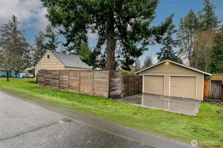 Set beyond the fully fenced backyard garden, the detached garage anchors the rear of the property and adds a rare sense of space and utility to the corner lot.