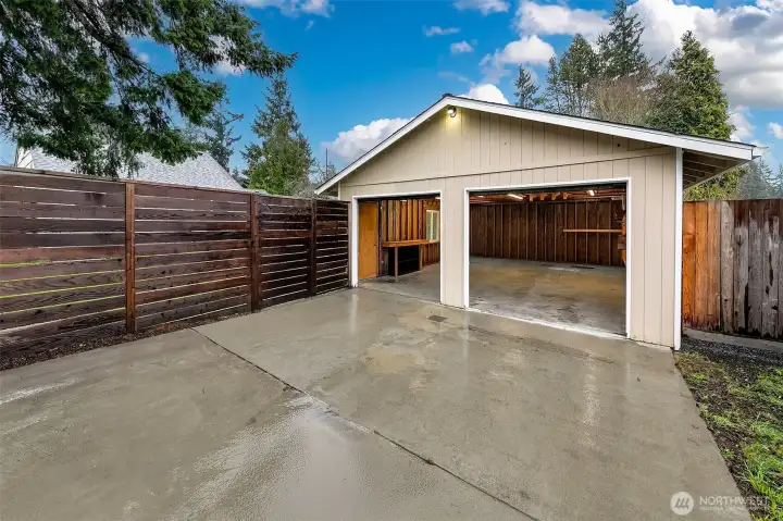 The detached garage completes the property with a sense of openness and practical utility.