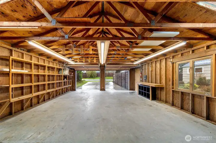 Cathedral ceilings and expansive open space transform the oversized detached two-car garage into more than just parking, an ideal setting for projects, hobbies, creative pursuits, or future possibilities.