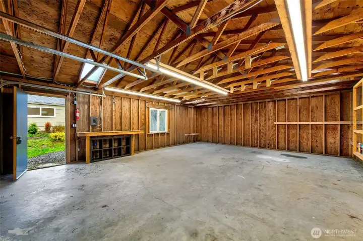 With generous proportions and soaring ceilings, the detached garage offers flexible shop space that easily adapts to storage, workspace, or weekend tinkering.