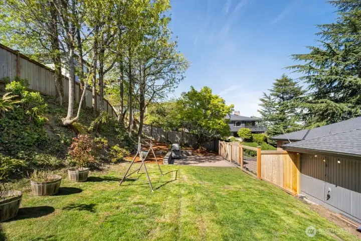 Fenced backyard perfect for gardening, pets, and playtime